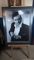Full image of the framed Johnny Cash photographic art print on easel