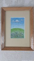 Full view of the framed watercolour painting showing the entire art piece within a wooden frame and acid-free matting.