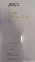 Close-up of Creative Memories 12x12 inch page protector package front, showing product details and sheet count.