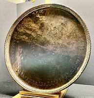 Full front view of tray on wooden stand against black backdrop