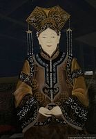 Close-up of painted Empress Tzu-hsi on glass showing attire details