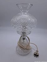 Full view of assembled Waterford crystal electric lamp showing base, mid-column, shade, cord and plug