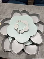 Top view showing the 10 separate heart-shaped compartments arranged around the flower shape base.