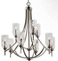 Front view of the chandelier showing nine curved brushed nickel arms and nine textured cylindrical clear glass shades.