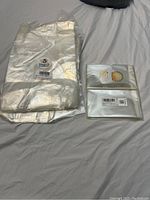 Stack of clear plastic bags in original packaging showing brand label and barcode.