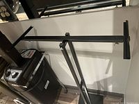 Overview of the towel rack showing the adjustable horizontal bar and base.