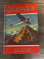 Front cover of Secrets of the Andes book with colorful airplane and mountain design