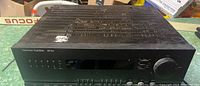Front view of the Harman/Kardon AVR 25II stereo receiver showing the top ventilation and overall housing condition.