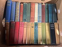 Photo showing 26 assorted antique hardcover books in a box, various colors and titles, mostly works by Joseph G. Galusha and other authors on Lincoln and historical themes.