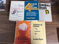 Lot of five vintage books laid out side by side. Titles visible are 'The First Linington Quartet', 'Four by Egan', 'Random Death', 'A Serious Investigation', and 'A Choice of Crimes'.