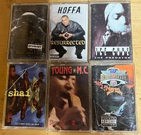 Front view of six cassette tapes showing cover art featuring 90s rap and R&B artists.