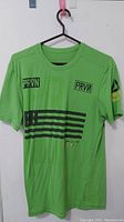 Front view of green Reebok CrossFit men's T-shirt showing PRVN and stripe graphics