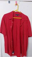 Front view of the red Tommy Hilfiger short sleeve shirt, showing the button-up style and pattern