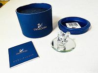 Photo showing the original blue Swarovski box, certificate booklet, mirror base, and crystal mouse figurine.