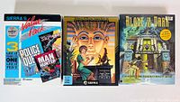 Three boxed Sierra computer games from the 1990s: Sierra's Value Pack with 3 games (Silpheed, Police Quest, Man Hunter), The Oracle of Ammonra, and Alone in the Dark, showing cover art and good condition.