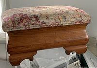 Side view showing wooden base and cushion profile