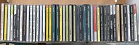 Photo displaying all 34 jazz CD cases lined up side by side showing various classic jazz album titles and artists.