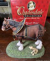 Side angle view of the Clydesdale figurine with red box behind showing collection name.