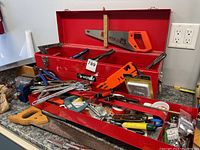 Open toolbox overview showing red Husky box and its contents on countertop