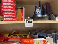 Emergency candles, matches, and walkie-talkie on shelf