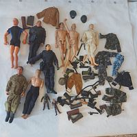 Top view of all figures, clothing, boots, helmets, and weapons organized on white background.