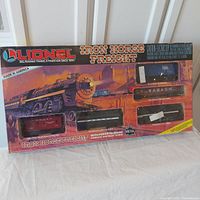 Original Lionel Iron Horse Freight box with scenic artwork and visible four windows displaying train cars; box shows wear and color fading.