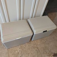 Two Koolatron Kool Kaddy portable coolers/warmers placed side by side on floor, showing overall shape, size and color.