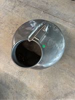 Top view showing rounded body and opening of the antique milk can