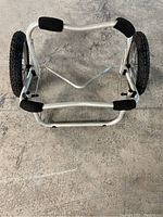 Top view of the kayak roller cart showing the padded support areas and wheel alignment.