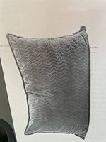 Gray Lounge&Co Crash lounge pillow showing chevron pattern texture on fabric.