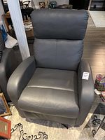 Front view of dark gray leather recliner chair