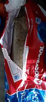 Partially opened bag of Rockwool insulation showing portion of mineral wool inside