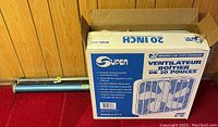 Original box for the 20-inch Super fan, model 32-13, showing product features in English and French.