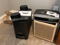 Main components of the BOSE 3.2.1 GSX Series III system arranged together: receiver, subwoofer, satellite speakers, remote control, and manuals.