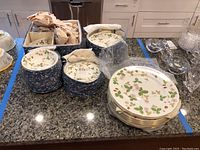 Overview of boxed dinnerware and stacked plates on counter