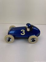 Side view of the blue Playforever Bruno Racing Car showing the number 3 decal and driver figure