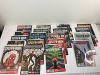 19 The Superior Spider-Man and related Spider-Man comic books spread out, showing covers with varied artwork, boarding and protective covers visible.