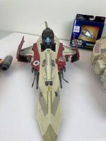 Top view of Obi-Wan Kenobi Starfighter vehicle showing cockpit, wing detail, and droid figure attached