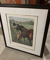 Framed print featuring three horses near a hedgerow in a rural setting, signed and numbered visible in photo.