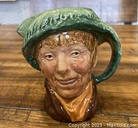 Front view of Royal Doulton Toby Jug depicting Arriet