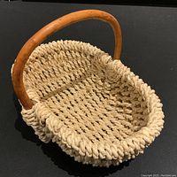 Photo of the woven basket showing the handle and weave pattern