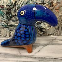 Front and side view of the large Mexican pottery bird showing detailed blue patterns and shape