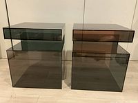Front view of two smoked acrylic side tables side by side