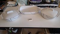 Three Corelle Coordinates stoneware baking dishes on a table showing set layout and design.