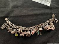 Full view of the sterling silver charm bracelet with all charms attached.