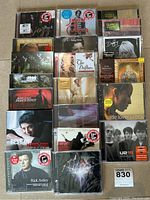 Overview of 19 music CDs from various artists including Rick Astley, Bryan Adams, U2, Joni Mitchell, The Drifters, Sade