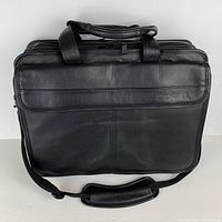 Full front view of the black leather DELL executive laptop travel bag with handles and adjustable padded shoulder strap.