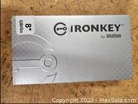 Front of retail packaging for 8GB IronKey by Imation flash drive, silver-gray box with branding and capacity.
