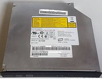 Top view showing manufacturer label, model AD-7530B, certification marks, and serial numbers.