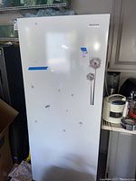 Front view of freezer with decals